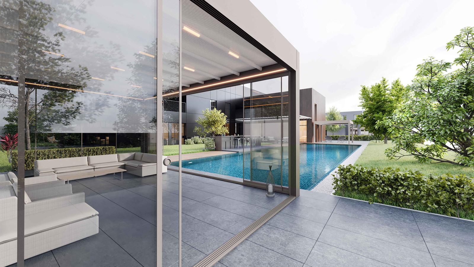 Modern house with Sliding Glass Systems featuring a glass enclosed pool area and patio with glass wall.
