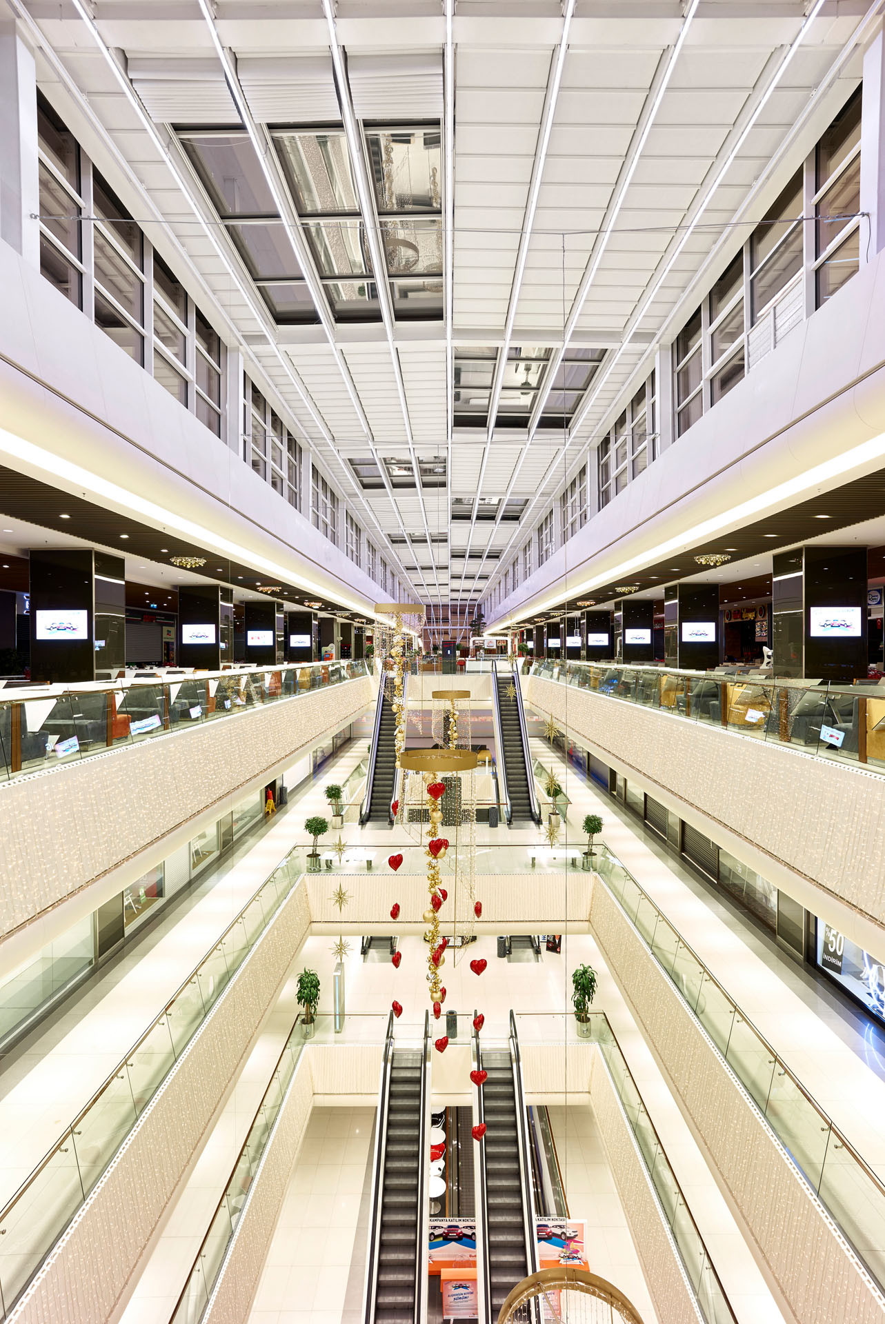 A spacious interior with a massive metal and tailor made fabric pergola roof.