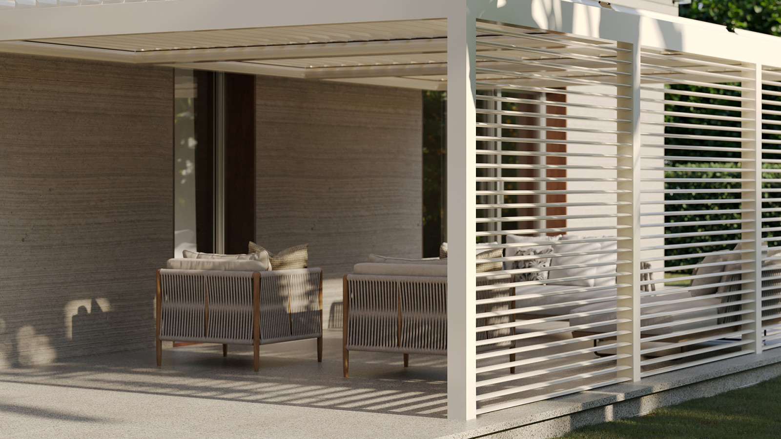 White furniture in a contemporary outdoor space with a sun breaker.